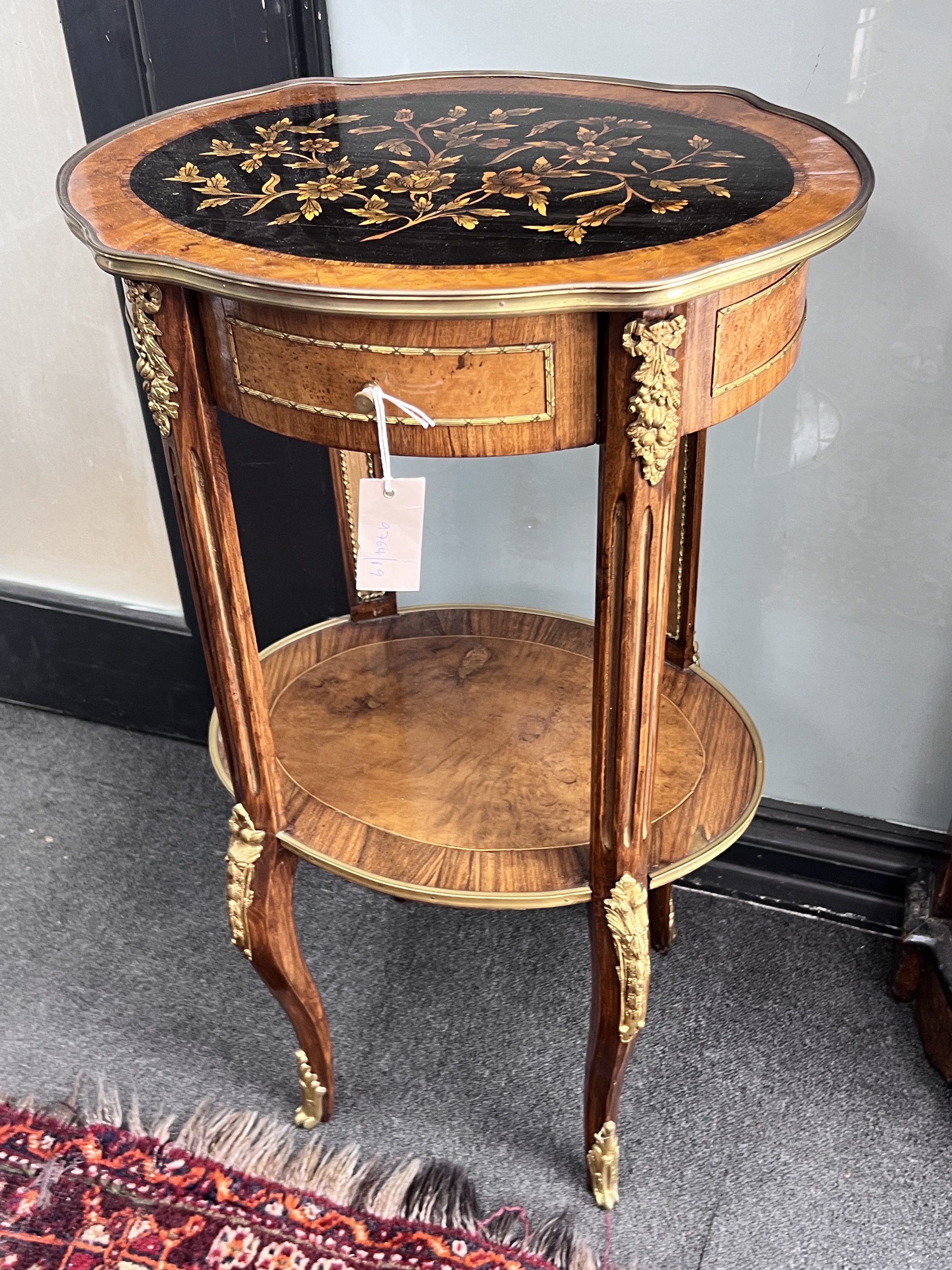 A Louis XVI style inlaid gilt metal mounted two tier table, width 47cm, depth 37cm, height 83cm